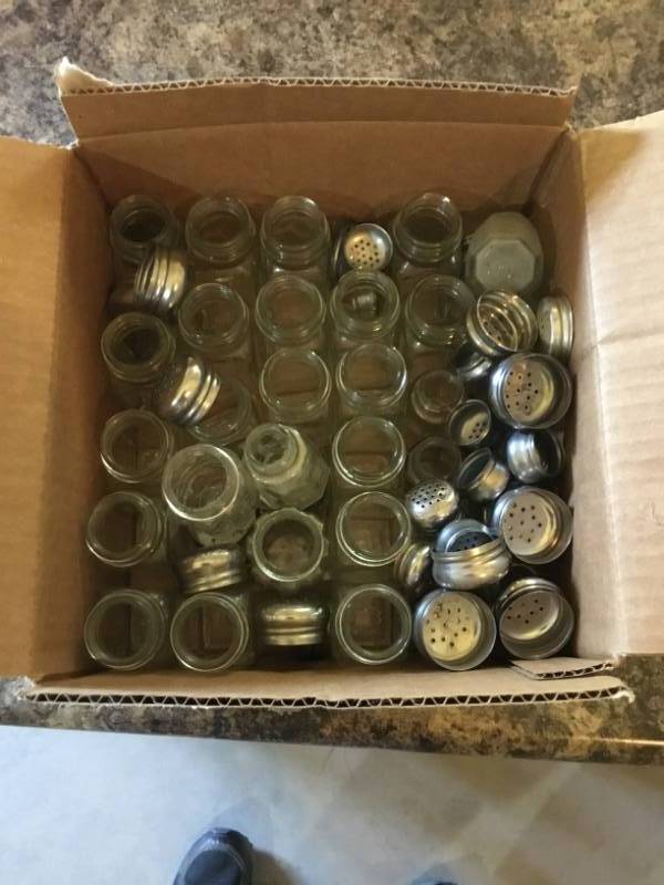 lot 195 image: Box full of salt and pepper shakers.