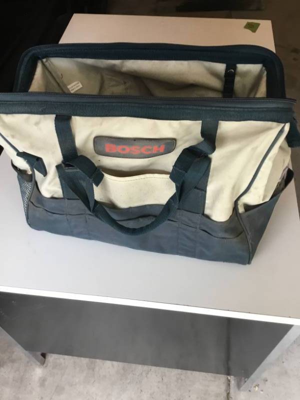 lot 13 image: Bosch tool bag with misc in it.