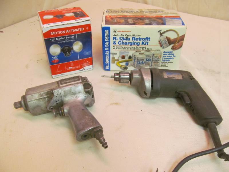 lot 180 image: Motion Activated Light, Skill Impact Wrench, Black & Decker Heavy Duty Drill, Charging Kit