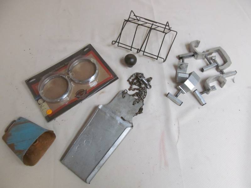 lot 38 image: Harley Davidson Parts, Copper Clamps, Shift Nob, Cowbell, Butchers Knife Sheaf