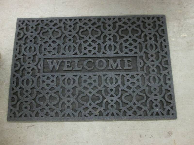 lot 22 image: Black Sculpted Welcome Mat...