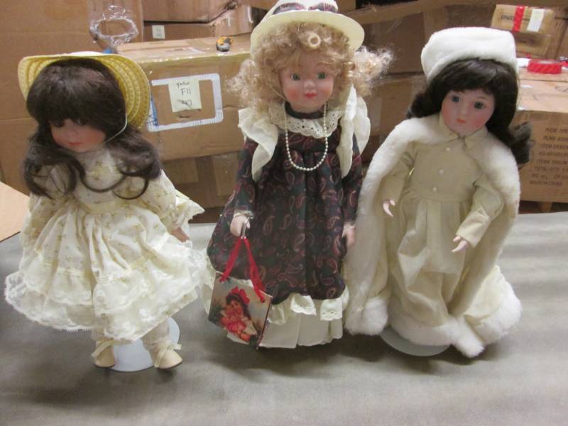 lot 145 image: Lot of 3 Collectible Dolls with Sta...