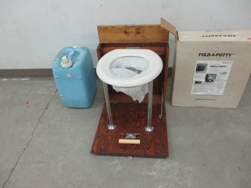 lot 54 image: Fold-a-potty and water jug great for camping or lake days