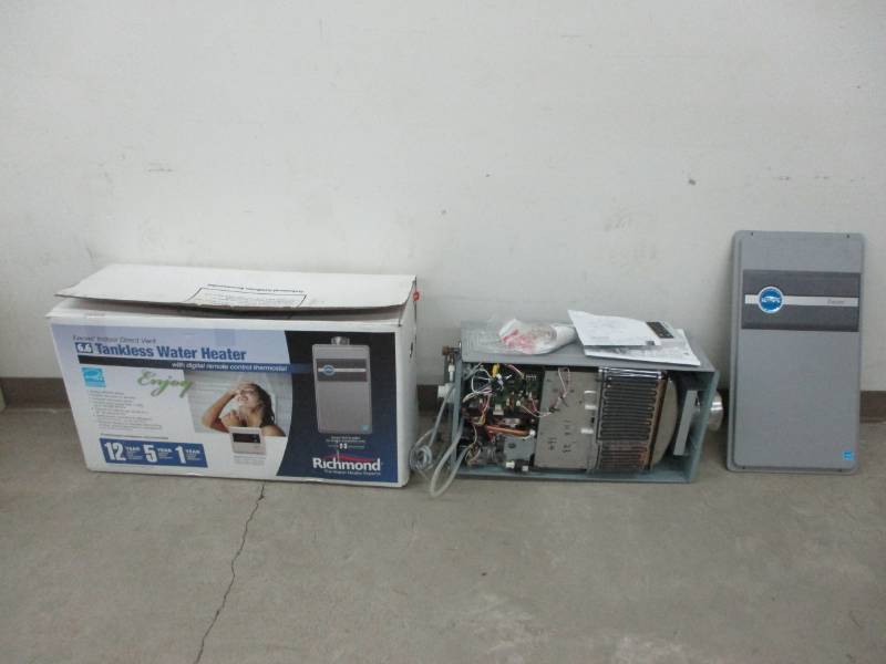 lot 55 image: Tankless Gas water heater mot tested Gas supply id 34 and water supply is 34 11,000 to 180,000 BTU hr