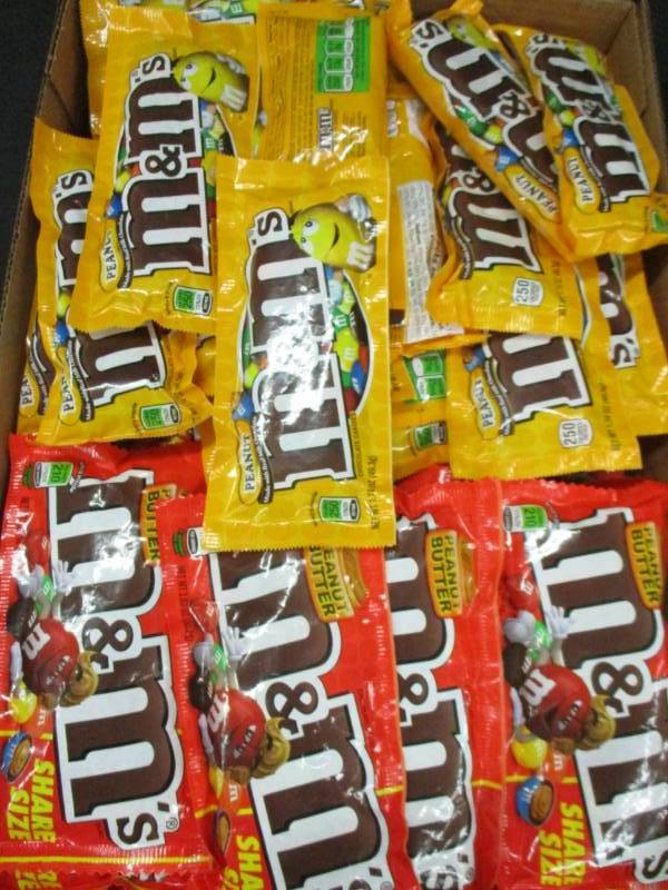 lot 121 image: 49 packs of Share size m&ms