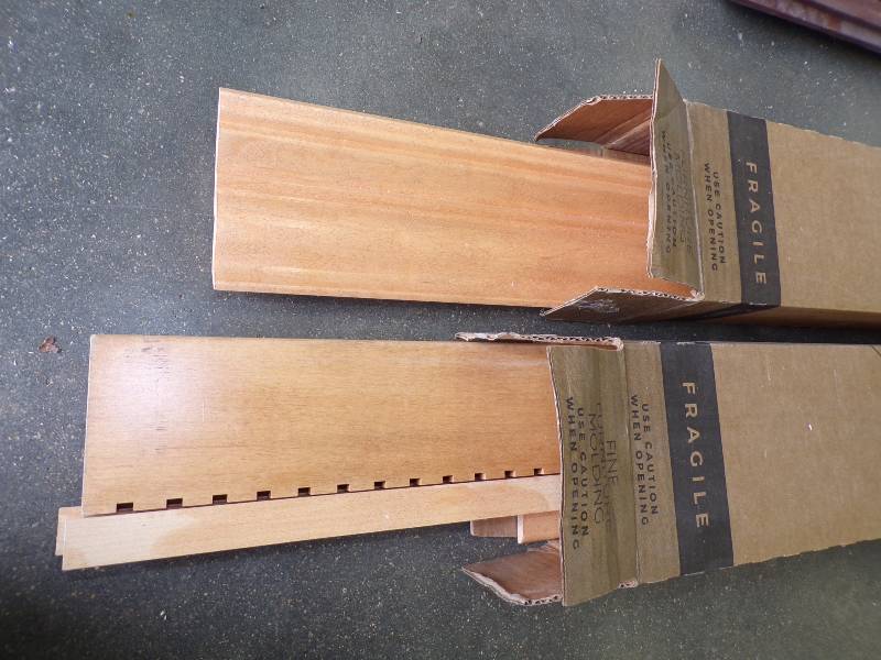 lot 40 image: Kraft Maid Maple Wood Crown Molding Strips.