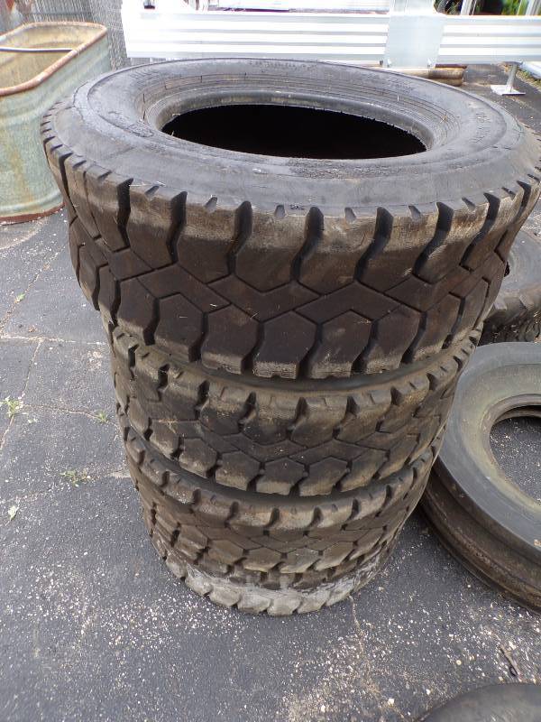 lot 61 image: Skid Loader Tire set of 4 Recaps 10 - 16.5 NHS