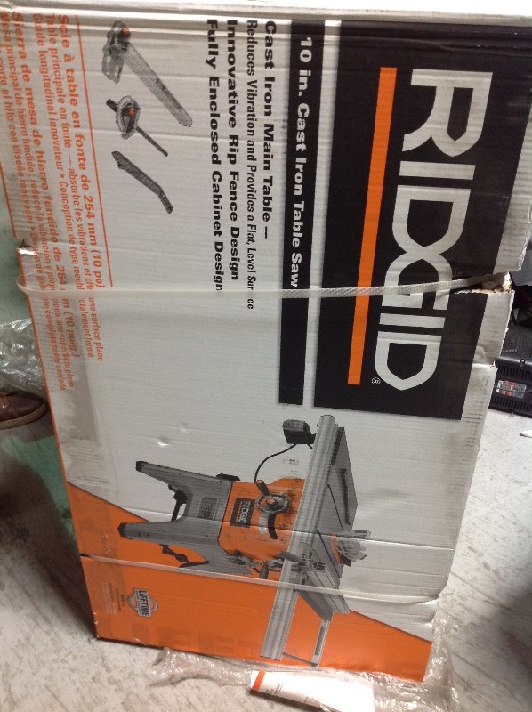 lot 104 image: Ridgid 13 Amp 10 in. Professional Cast Iron Table Saw not used