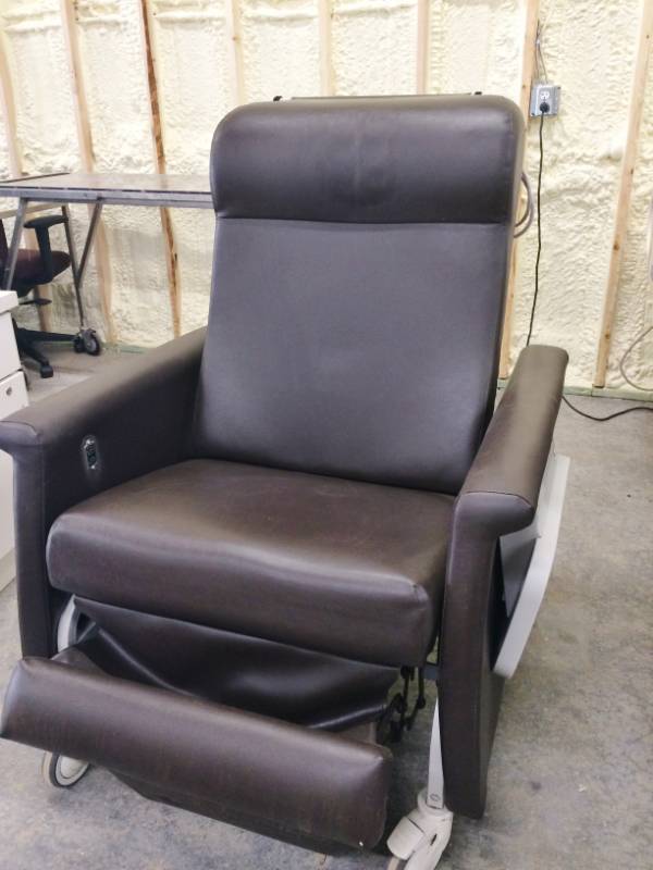 lot 27 image: WOW MSRP $3000 Winco Dual Swingaway Arm Carecliner Reclining Geri Chair With Heat &amp Massage - Easy Access For Wheelchair Patients - Great Working Condition Has Trays On Both Sides