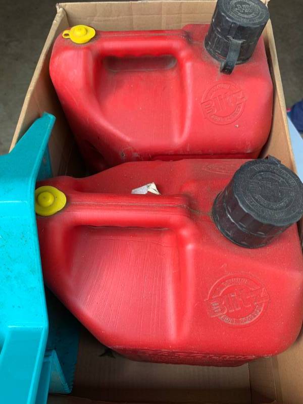 lot 142 image: (2) 2 Gallon Gas Cans and Dust Pan