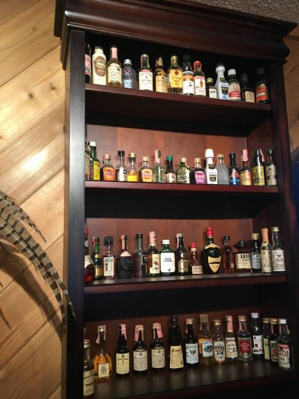 lot 385 image: Wooden Shelve with OldNew liquor Bottles