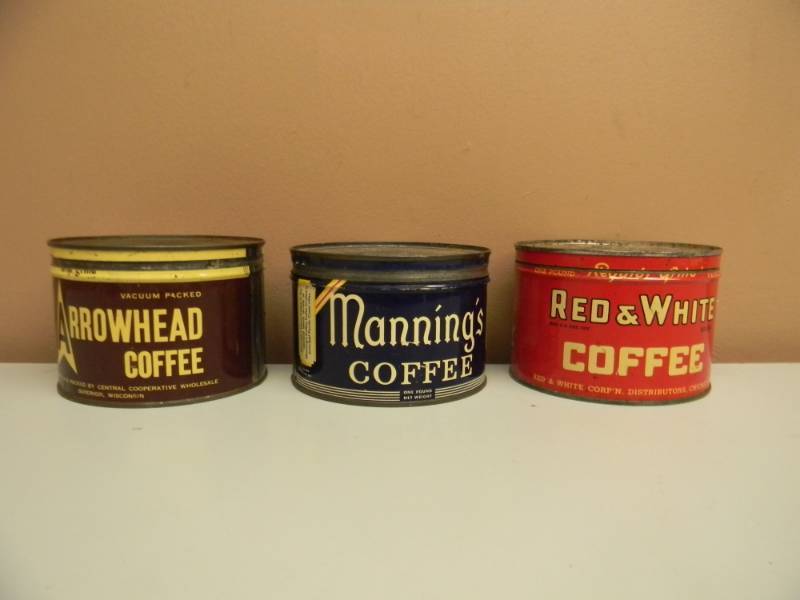 lot 21 image: 3 - VINTAGE ORIGINAL WITH LIDS RED & WHITE, ARROWHEAD & MANNINGS COFFEE CANS - ORIGINAL 1LB - SEE PICTURES