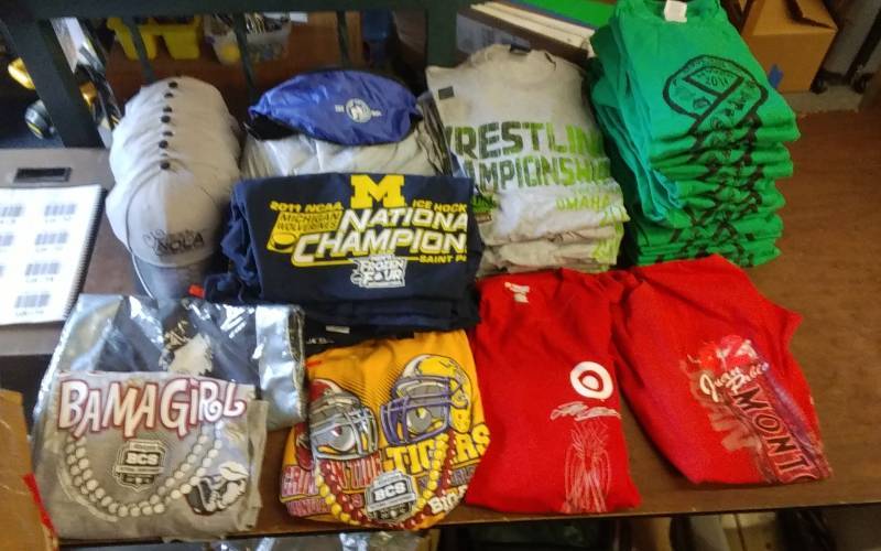 Lot Of 25-Assorted T-Shirts (Frozen Four, Racing, Wrestling, Tennis-18 Green, Fanny Packs, Back Sacks, 10-Caps)