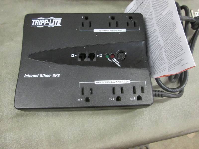 lot 243 image: Tripp-Lite Battery Back Up...