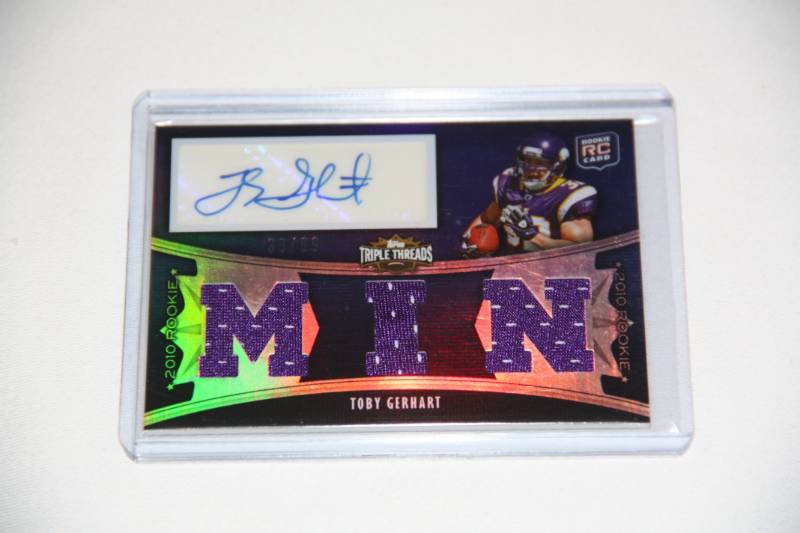 lot 27 image: 2010 Topps Triple Treads Toby Gerhart Auto Rookie Card 3899