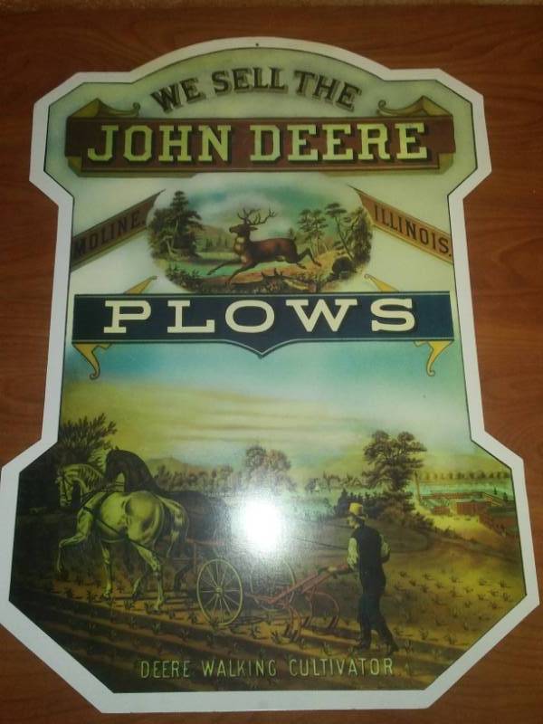 lot 27 image: John Deere plows sign