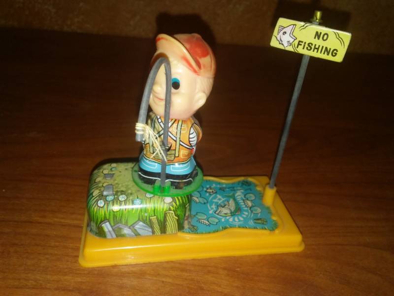 lot 47 image: Vintage wind-up fisherman