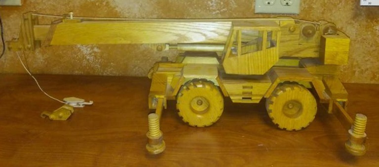 lot 68 image: Handcrafted wood crane toy