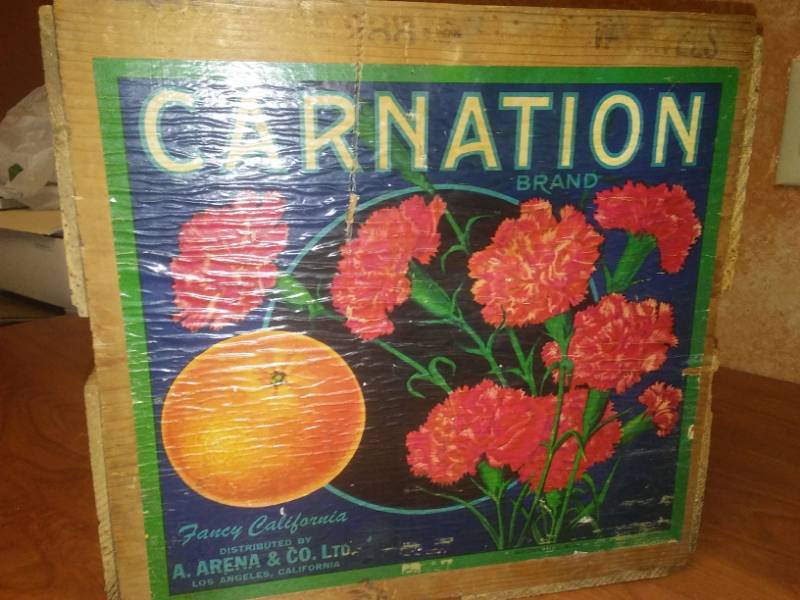lot 79 image: Carnation Brand fancy oranges wood crate