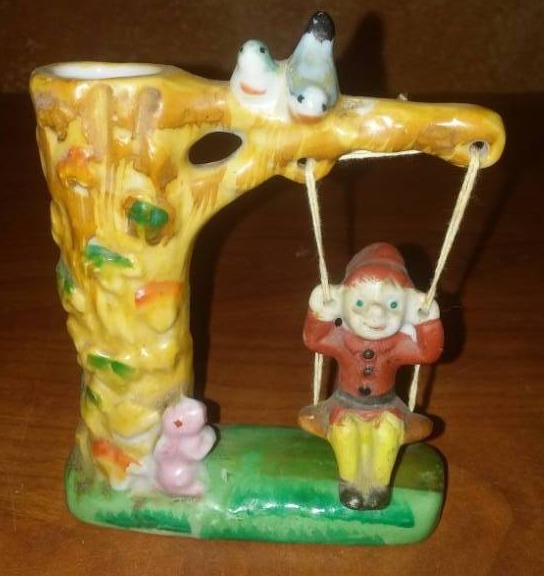 lot 135 image: Vintage ceramic swinging boy