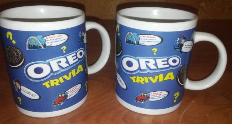 lot 210 image: 2 collectible Oreo trivia coffee mugs.