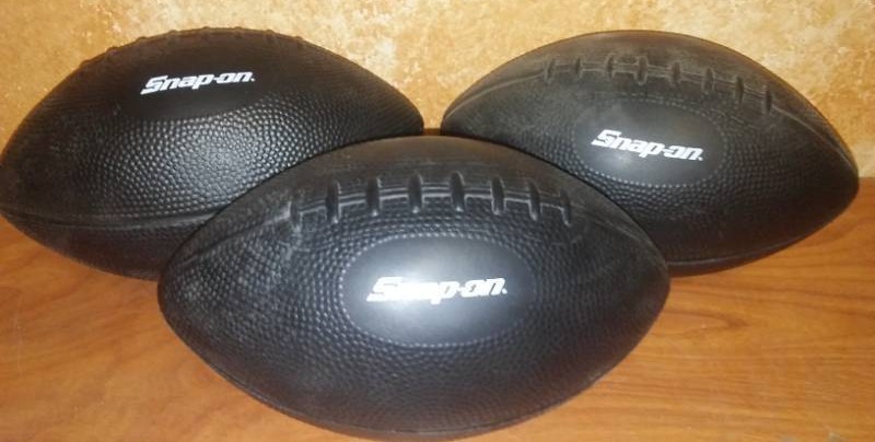 lot 212 image: 3 snap - on foam footballs. New, 8.5 in.