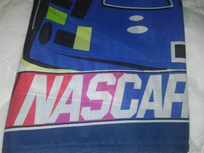 lot 213 image: 4 NASCAR pillowcases and more.