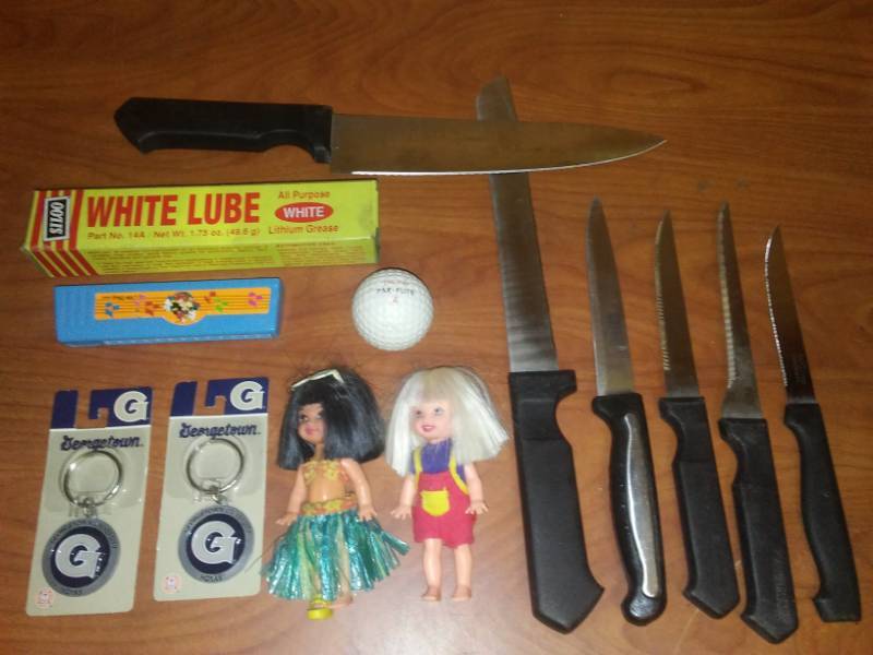 lot 218 image: Miscellaneous very old golf ball, Mickey Mouse harmonica, and more.