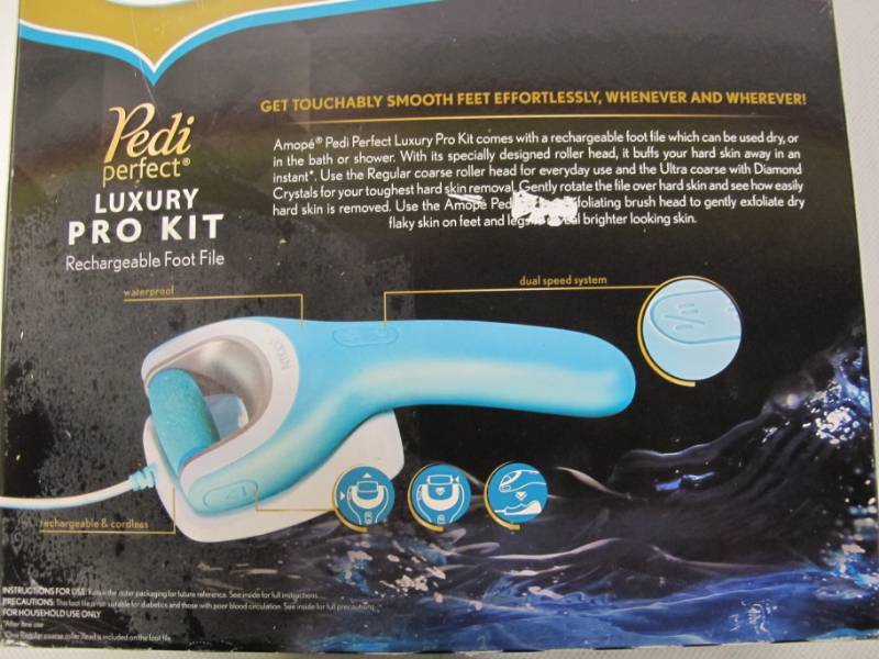 lot 33 image: Amope Pedi Perfect Luxury Pro Kit Wet & Dry Rechargeable Foot File, Regular Coarse