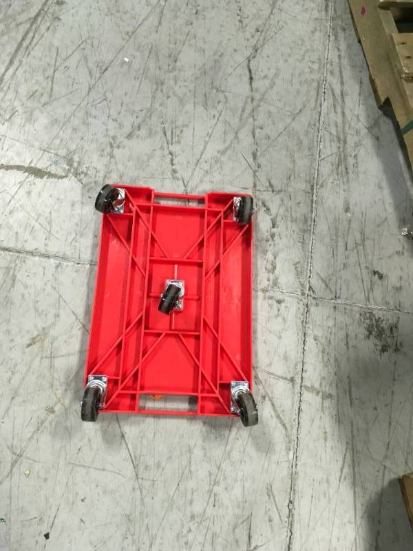 lot 19 image: Devault Enterprises 16 in. x 11 in. Multi-Purpose Red Garage Dolly in very good condition