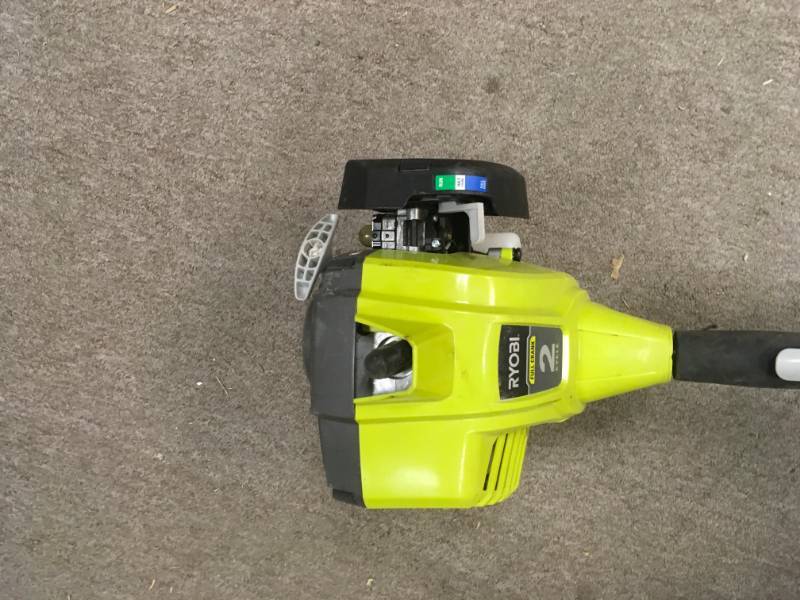 lot 102 image: RYOBI 25cc 2-Cycle Attachment Capable Full Crank Curved Shaft Gas String Trimmer in very good condition