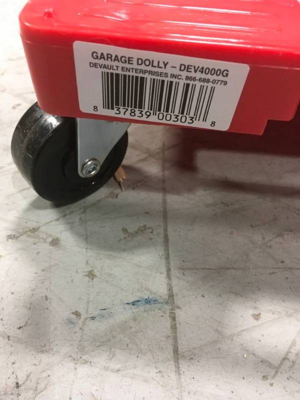 lot 90 image: Devault Enterprises 16 in. x 11 in. Multi-Purpose Red Garage Dolly in good condition