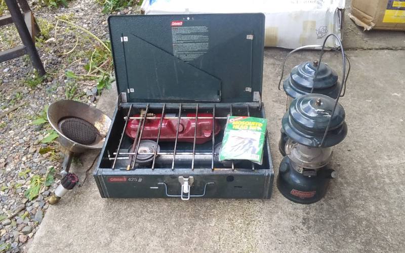 lot 11 image: Coleman 425 Camp Stove, 2-Coleman Lanterns, Mr Heater Sunflower, Mosquito Head Net