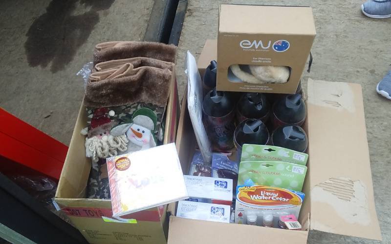 lot 55 image: 10-NEW Gone Fishing Stockings & Box Of NEW Giftwares (Coca-Cola Cups, Beatles CD, EMU Sheepskin Ear Warmers, More)