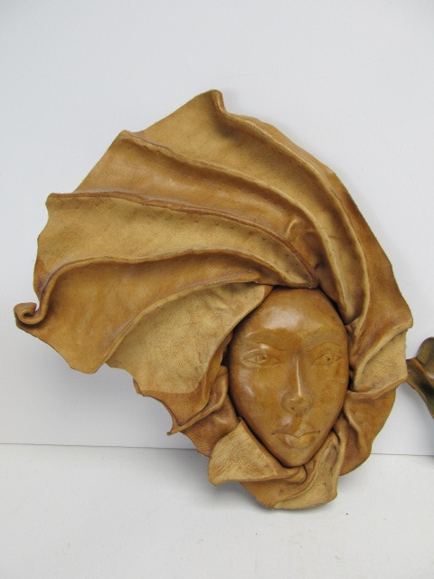 lot 308 image: Vintage Genuine Leather Wall Hanging Faces