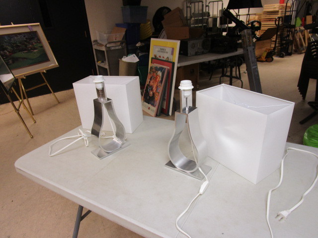 lot 442 image: A PAIR OF METAL LAMPS