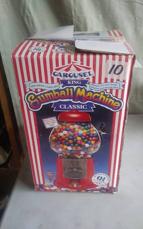 lot 10 image: Carousel Gumball Machine, Pogo Stick