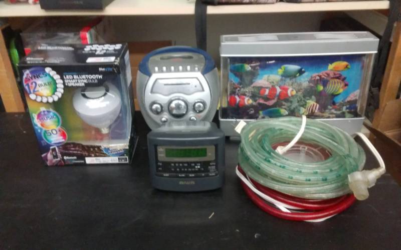 lot 44 image: Blue Tooth Speaker Light Bulb, Fish Tank Night Light, Memorex Boom Box, Rope Lights, Alarm Clock Radio
