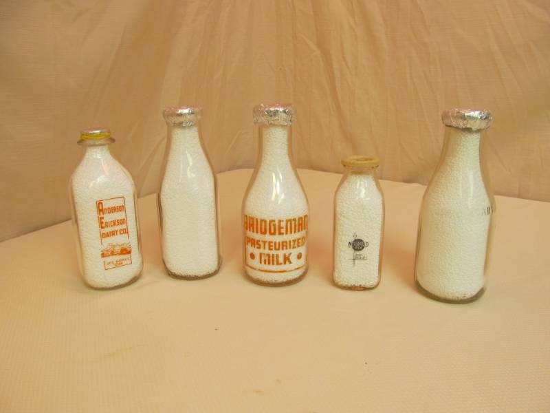 lot 11 image: Vintage Glass Milk Jars