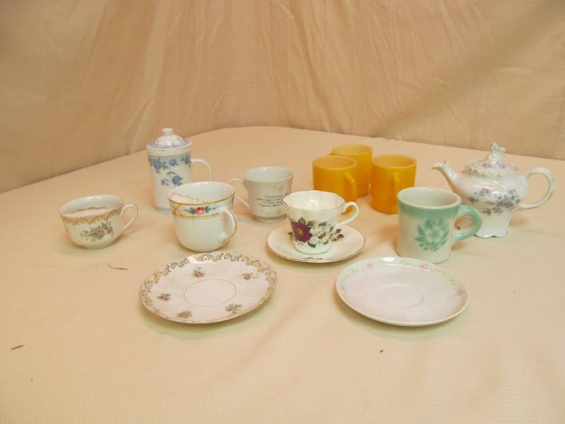 lot 21 image: Cups, Saucers, Teapot, Mustache Cups