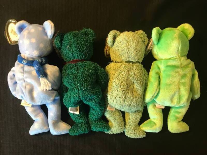 lot 52 image: Retired TY Beanie Babies 1999 Holiday Teddy, 2001 Holiday Teddy, Shamrock and Kicks