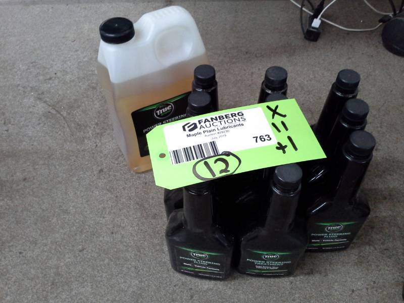 lot 763 image: 12 Bottles of TrueBrand Power Steering Fluid 64oz., Power Steering Fluid 11oz.