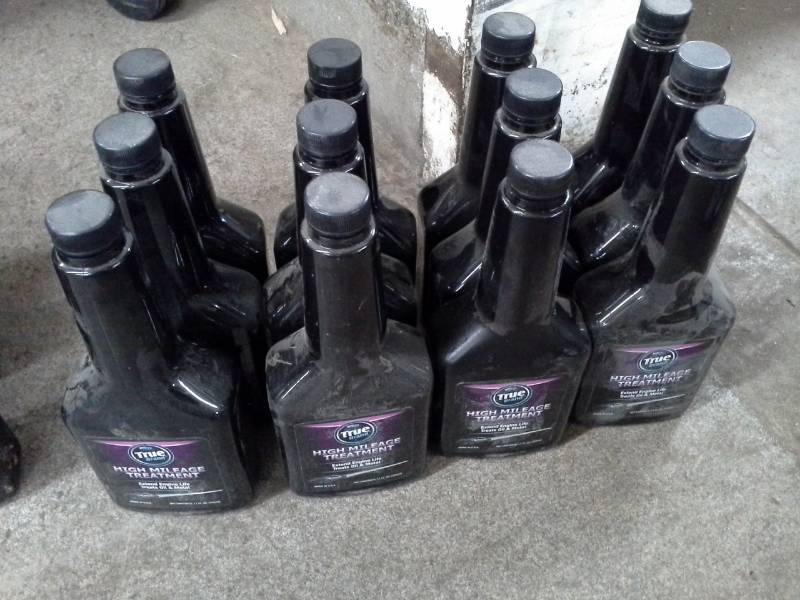 lot 764 image: 12 Bottles of TrueBrand High Mileage Treatment 11oz.