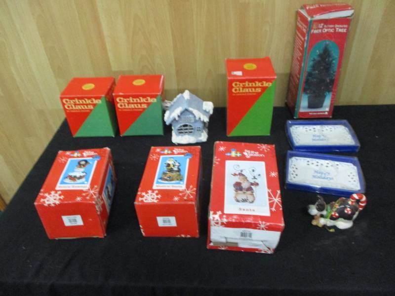 lot 40 image: Fiberoptic Tree, Snowman, Teddy Russian Criinkle Claus, Krenlin Krinkle, Lighthouse , Dutch Cricnkle Clause Music Box, Ornaments, and Happy Holiday Ornaments