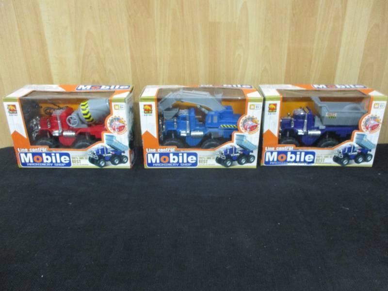 lot 42 image: Line Control Mobile Machinery Shop Remote Control Cement Truck with lights, Crane and dunp Truck