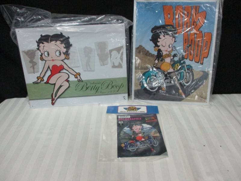 lot 105 image: 2 Metal Betty Boop Signs and halogram