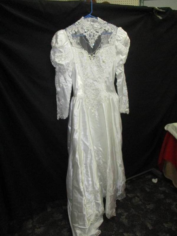 lot 148 image: Size Large Wedding Dress, Really nice and you could revamp into what you want or make all your kids Cristening gowns from it
