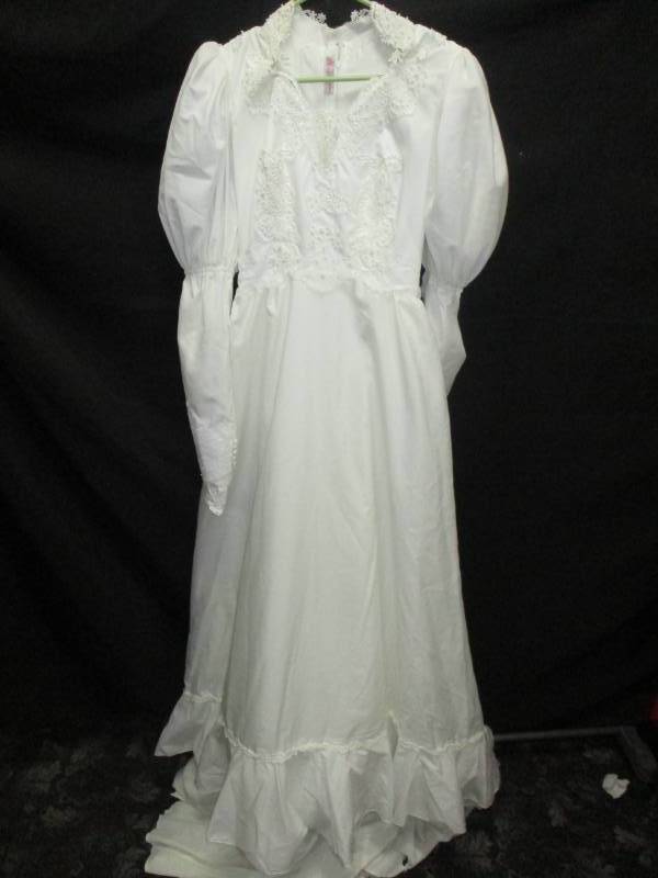 lot 149 image: Size Small Wedding Dress, Really nice and you could revamp into what you want or make all your kids Cristening gowns from it