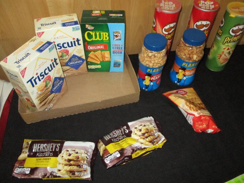 lot 351 image: Triscuts, club Crackers, Pringles, Herseys Chocolate chips, peanuts and more