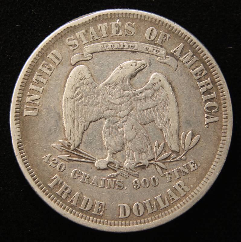 lot 01 image: 1877 US TRADE DOLLAR IN MID GRADE